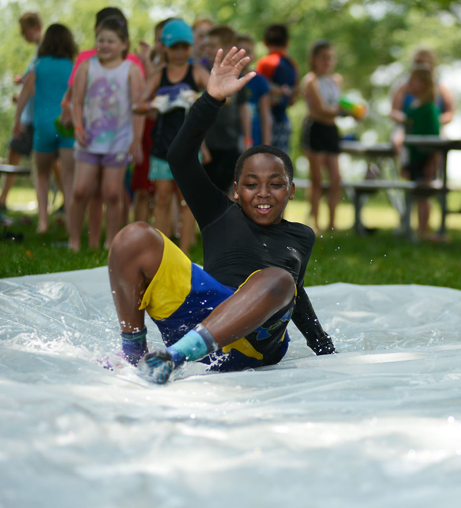 Jaden Love slides down a homemade slip n' slide